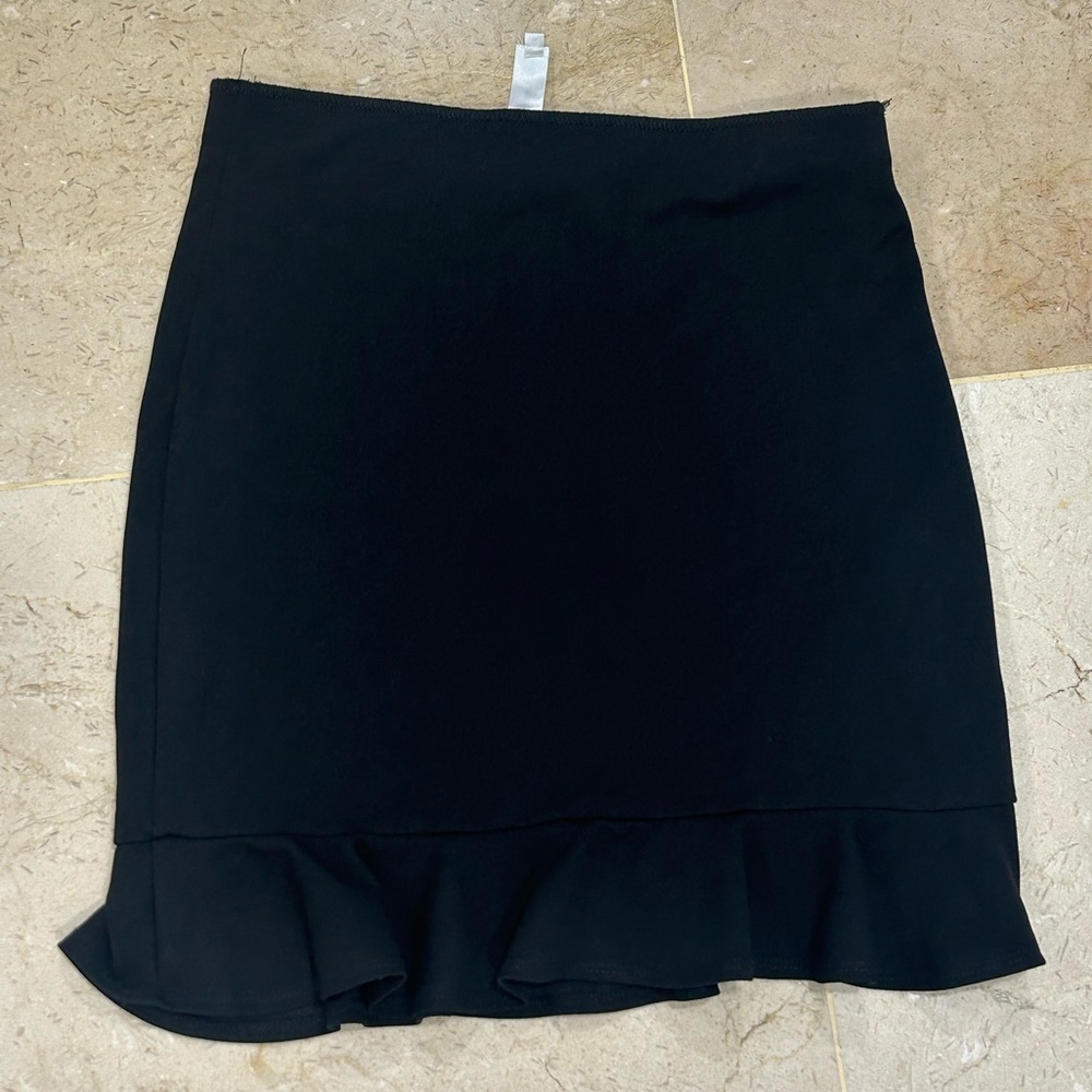 Black tight skirt with ruffles at the bottom